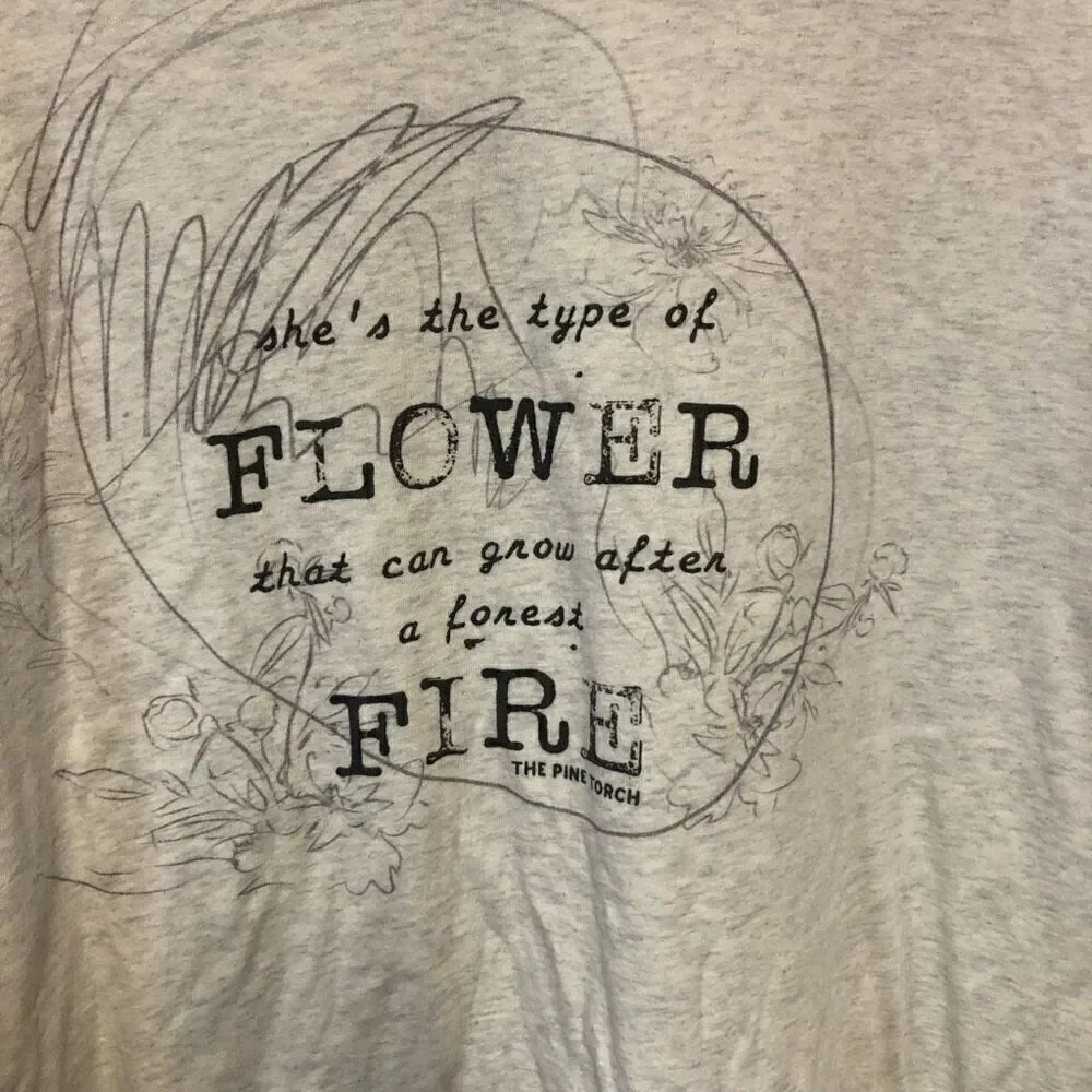 She's the type of FLOWER that can grow after a forest FIRE 